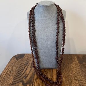 Set of two brown appleseed necklaces